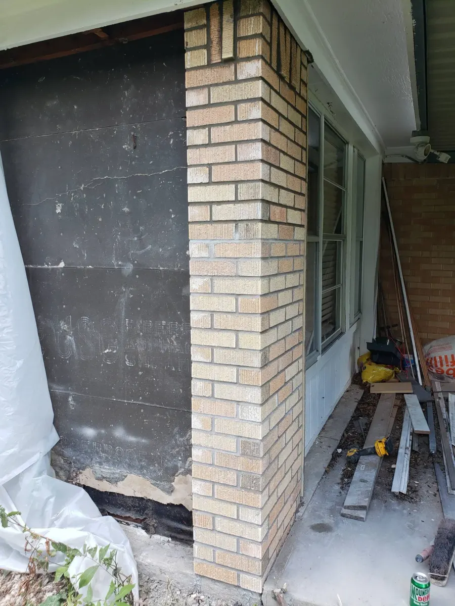 After: Repaired and rebuilt brick wall corner
